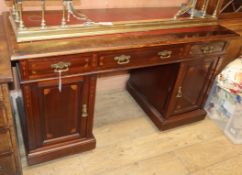 An Edwardian inlaid mahogany pedestal desk W.140cm