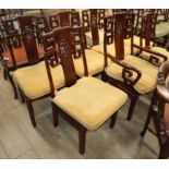 Seven Chinese hardwood dining chairs (one with arms)