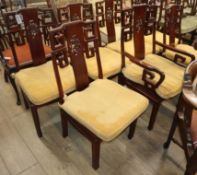 Seven Chinese hardwood dining chairs (one with arms)