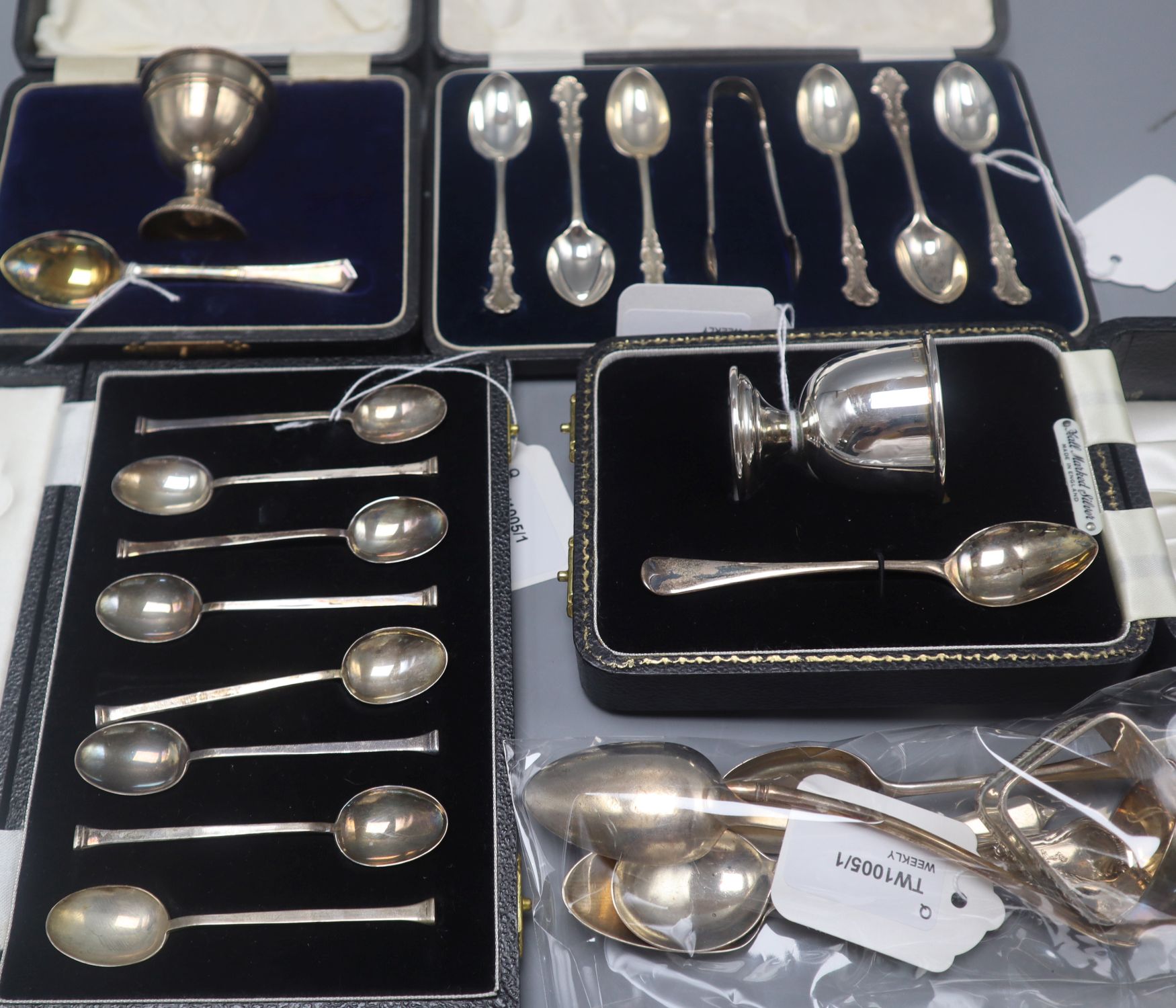 Two silver Christening sets, two sets of six silver coffee spoons (one with tongs), a napkin ring