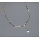 A modern 18ct gold and aquamarine set drop necklace, 47cm.