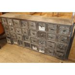 A vintage bank of 32 drawers W.164cm