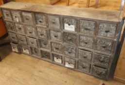 A vintage bank of 32 drawers W.164cm