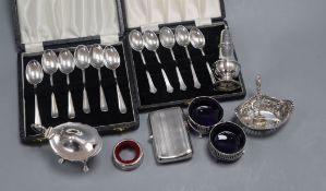 A collection of silver spoons, cruets and cigarette case etc.