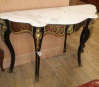 An ebonised boullework marble top serpentine front console table W.130cm