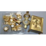 A collection of twelve novelty miniature brass clocks, a modern brass compass by Ross and a quartz