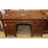 A mahogany kneehole desk W.138cm