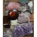 An amethyst geode, a small collection of mineral specimens, including pink quartz and two Japanese