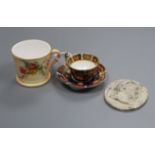 A miniature Royal Worcester mug, a miniature Royal Crown Derby cup and saucer and a Wedgwood and