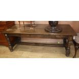 An 18th century style oak refectory dining table L.200cm