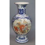 A Chinese blue and white baluster vase, with a polychrome painted panel height 47cm