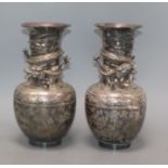 A pair of Japanese silver-plated bronze vases engraved and applied with dragons (one rim a.f.)