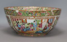 A Chinese Canton famille rose punch bowl, c. 1830-50, decorated with figures and flowers in