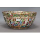 A Chinese Canton famille rose punch bowl, c. 1830-50, decorated with figures and flowers in