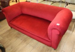 An Edwardian Chesterfield settee upholstered in red dralon W.180cm