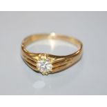 A George V 18ct gold and claw set solitaire diamond ring, the stone weighing approximately 0.