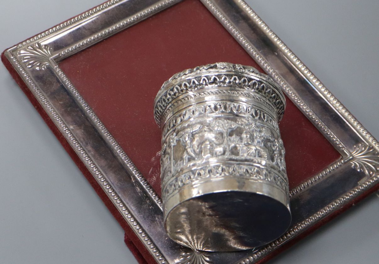 An Indian repousse white metal jar and cover and a silver plated photograph frame. - Image 2 of 2