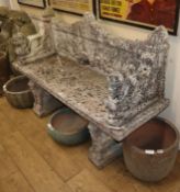 An Egyptian style reconstituted stone garden bench W.154cm