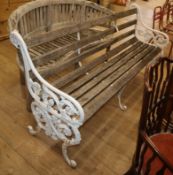 A Victorian style cast iron slatted garden bench W.182cm