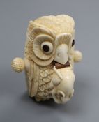 A carved bone novelty tape measure modelled as an owl with mouse height 6cm