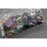 A quantity of assorted unmounted cut paste and gemstones, including amethyst, citrine, opal and