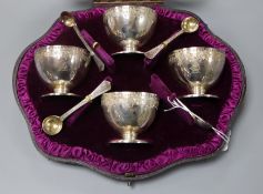 A cased set of 4 Victorian engraved silver salts and four spoons, London, 1882.