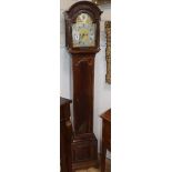 A Georgian style mahogany grandmother clock, striking on gong and having brass break-arch dial