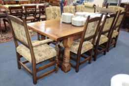 An 18th century design large oak refectory table and eight chairs (two with arms) Table 260 x 90cm