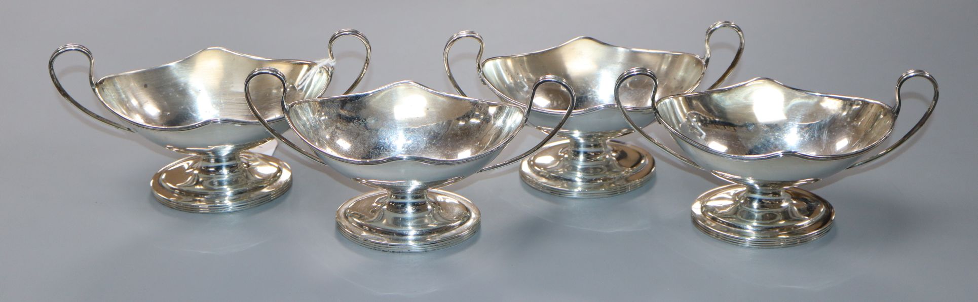 A set of four George III silver two handled boat shaped salts, William Abdy I, London, 1786, width