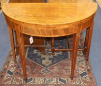 A George III satinwood banded mahogany demi-lune card table W.92cm