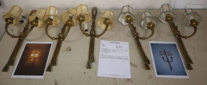 A set of five French Louis XVI brass 'rope and tassel' design two-branch wall lights