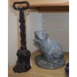 A late Georgian Coalbrookdale cast iron doorstop modelled as a lion's paw and a lead frog garden