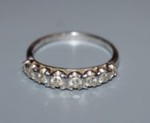 An 18ct white gold and diamond eight-stone half-hoop ring, size S.