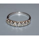 An 18ct white gold and diamond eight-stone half-hoop ring, size S.