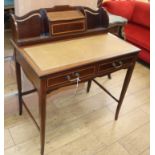 An Edwardian satinwood banded mahogany desk W.84cm