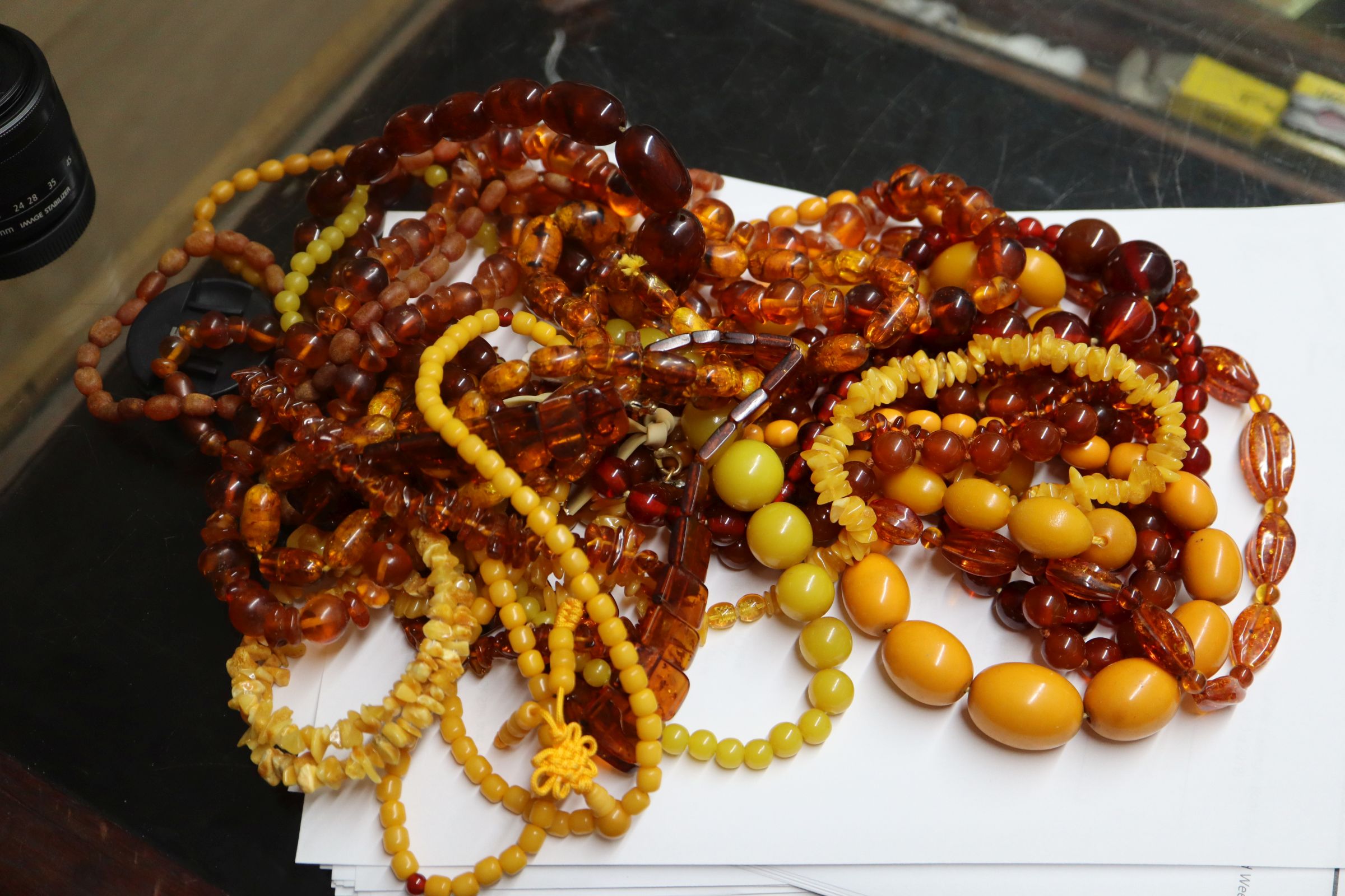 A quantity of amber and faux amber bead necklaces. - Image 2 of 8