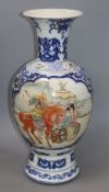A Chinese blue and white baluster vase, with a polychrome painted panel height 47cm