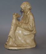 Mary Buchanan (1876-1958). A pottery figure of a seated lady and her dog, incised and dated 1929