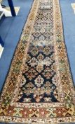 A Caucasian blue ground runner 410 x 97cm (a.f.)