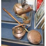 A graduated set of copper saucepans and mixed copperware