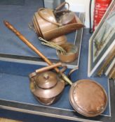 A graduated set of copper saucepans and mixed copperware