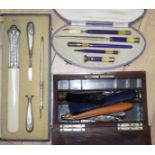 A Burr yew stationery box, two cased writing sets and sundries