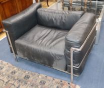 A pair of Corbusier style chrome and leather armchairs