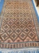 A Turkish geometric rug 240 x 145cm