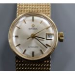 A lady's 1960's 9ct gold Omega automatic wrist watch, on integral 9ct gold Omega bracelet, gross