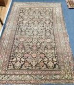 A North West Persian fawn ground rug 192 x 123cm (faded)