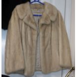 A blonde mink coat, three quarter sleeves, waist length, evening jacket