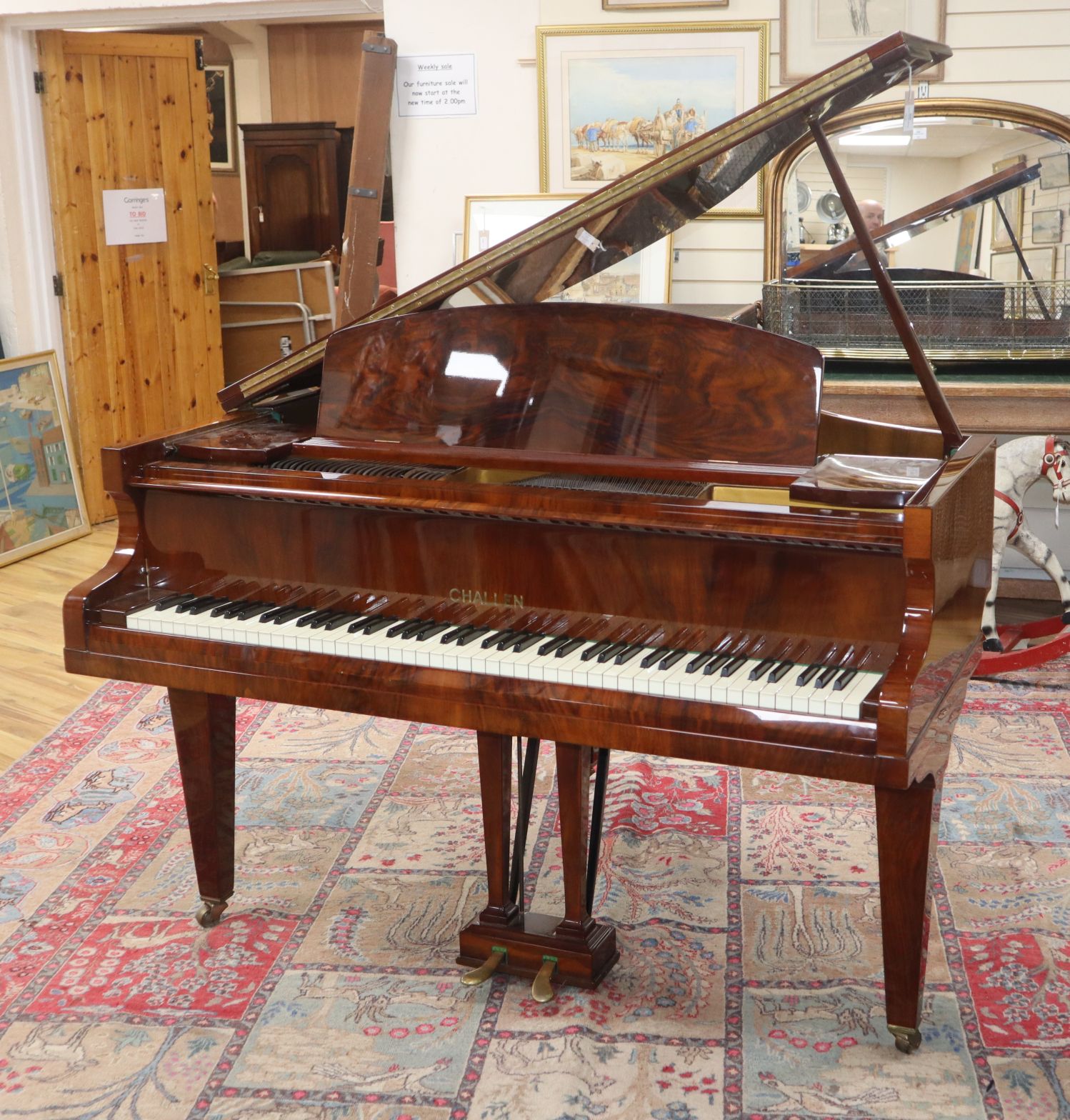 A modern walnut baby grand piano by Challen