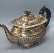 A George V silver demi fluted oval teapot, London, 1925, gross 21.5 oz.