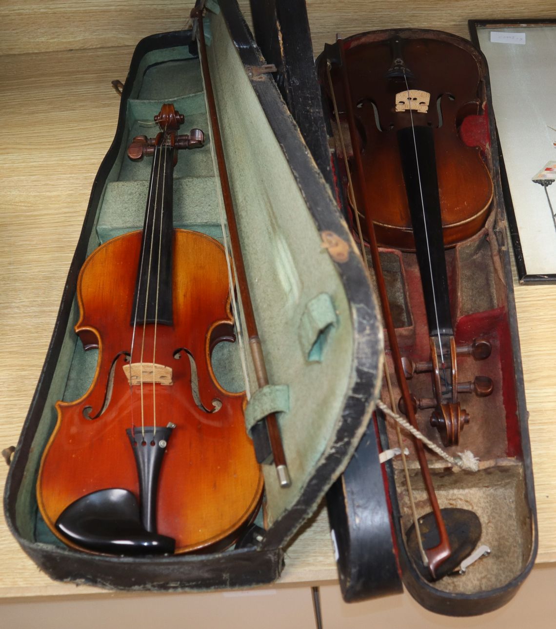 Two cased violins, one by Louis Fricot, Poussay dated 1935?,